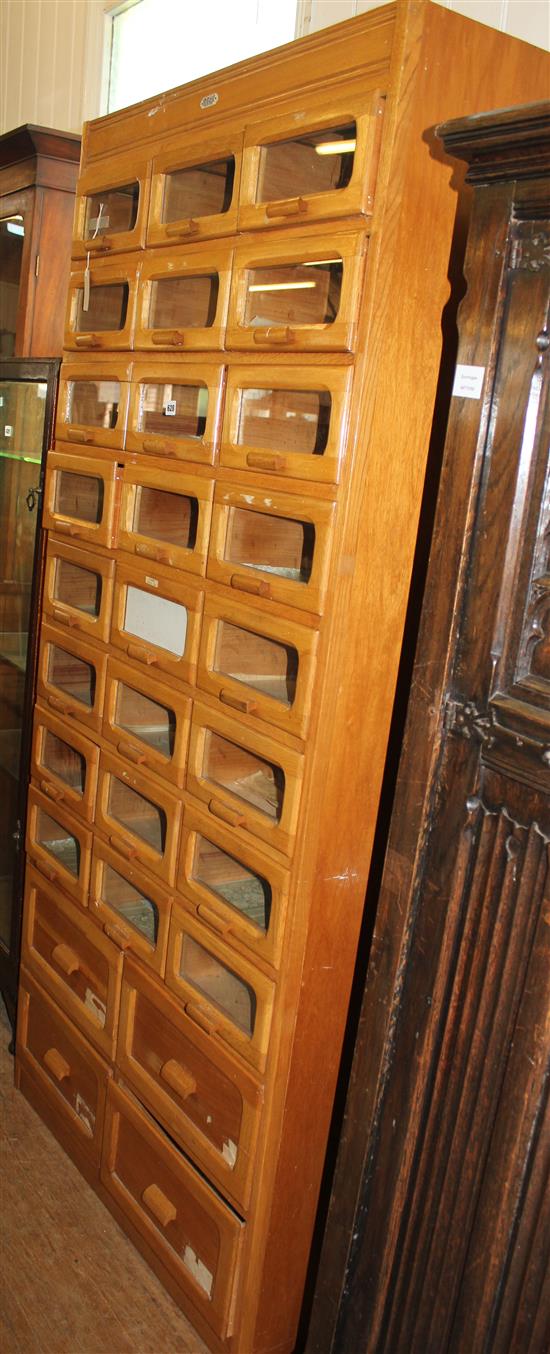 Haberdashers wooden cabinet, by Liddle, Keen & Co fitted 28 drawers